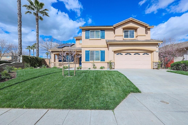 view of front of home featuring an attached garage, solar panels, concrete driveway, stucco siding, and a front yard