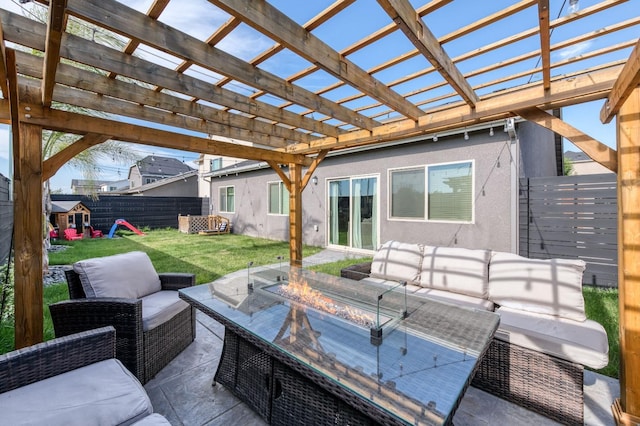 view of patio with an outdoor living space with a fire pit, fence, and a pergola