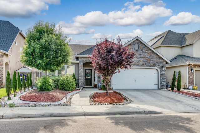 view of front of house featuring an attached garage, stone siding, a shingled roof, and concrete driveway