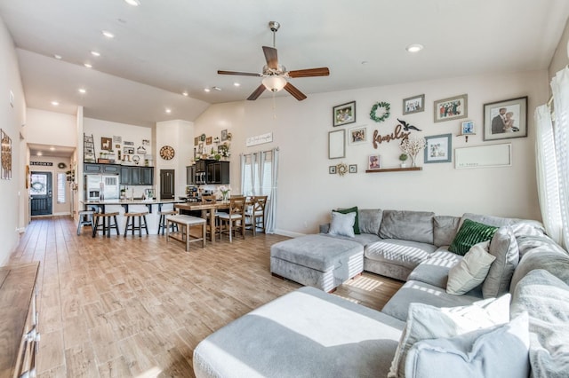 living area with recessed lighting, plenty of natural light, and light wood finished floors