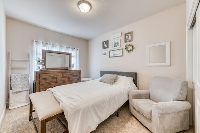 bedroom featuring light colored carpet