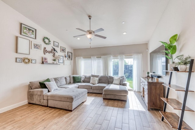 living area with lofted ceiling, recessed lighting, light wood-style floors, a ceiling fan, and baseboards