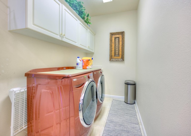 3033 Hanson Ave, Clovis, CA 93611 - washroom featuring independent washer and dryer, cabinet space, light tile patterned floors, and baseboards