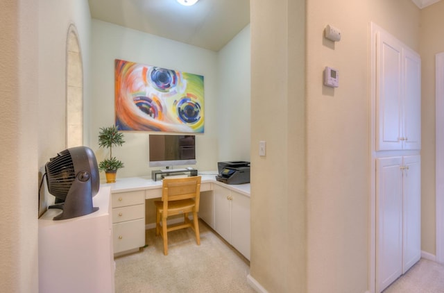 office featuring light colored carpet and built in desk