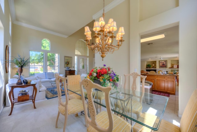 dining room featuring light tile patterned floors, a notable chandelier, light carpet, a towering ceiling, and crown molding