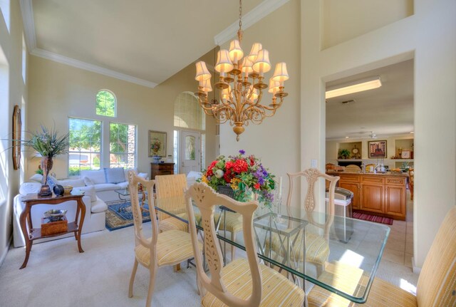 3033 Hanson Ave, Clovis, CA 93611 - dining area with a high ceiling, a chandelier, and crown molding
