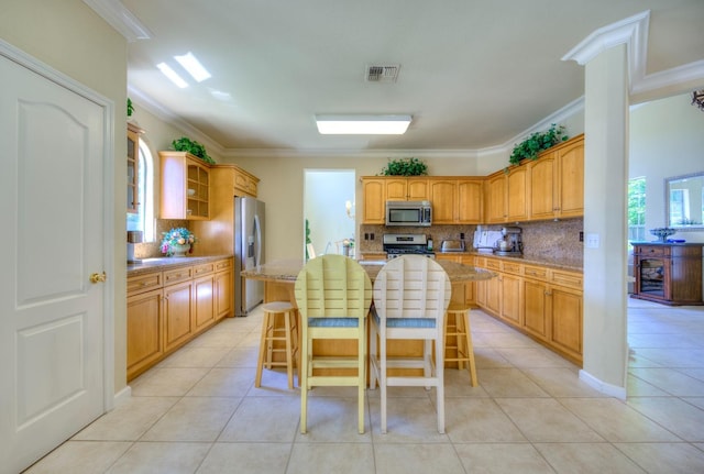3033 Hanson Ave, Clovis, CA 93611 - kitchen with appliances with stainless steel finishes, ornamental molding, backsplash, light tile patterned floors, and open shelves