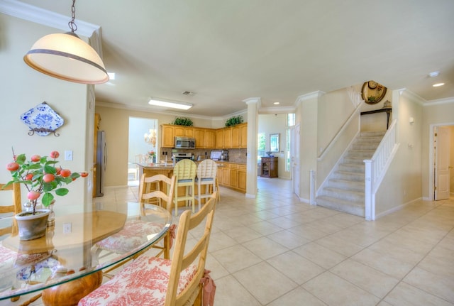 dining area featuring visible vents, stairway, ornamental molding, light tile patterned flooring, and baseboards