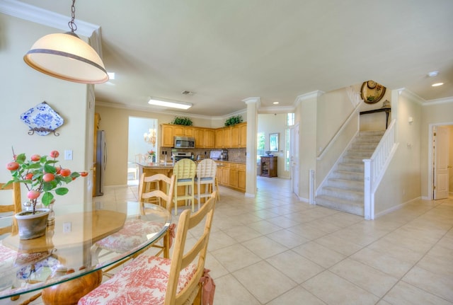 3033 Hanson Ave, Clovis, CA 93611 - dining room with crown molding, stairway, light tile patterned floors, recessed lighting, and baseboards