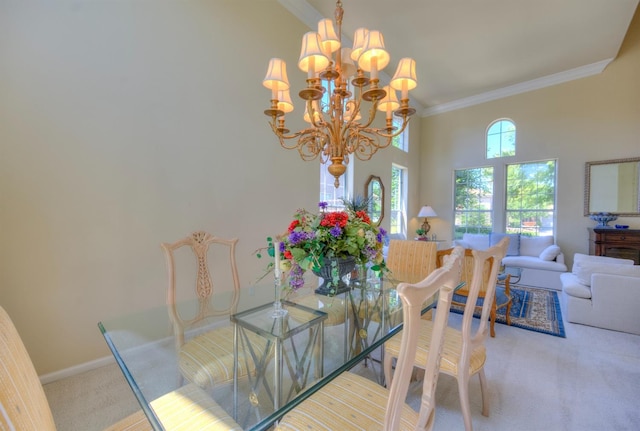 dining space with a notable chandelier, a high ceiling, baseboards, carpet, and crown molding