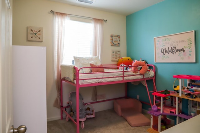 bedroom featuring carpet floors and visible vents