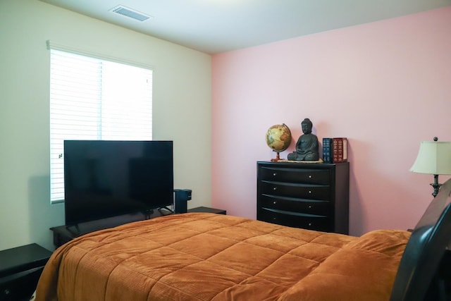 bedroom featuring visible vents