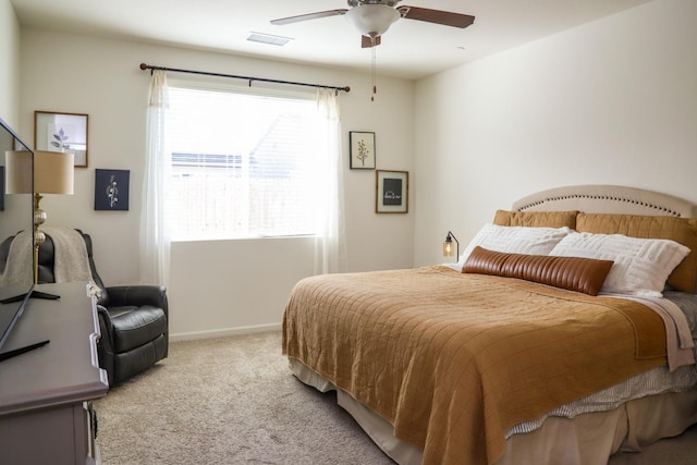 bedroom featuring light carpet, ceiling fan, visible vents, and baseboards