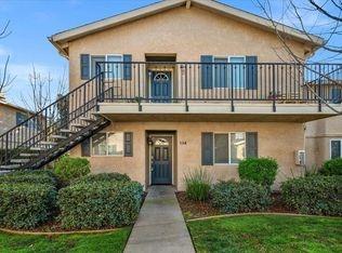 view of front of house featuring stairs and stucco siding