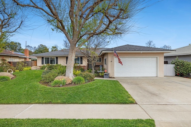 ranch-style house with a garage, driveway, a front yard, and fence