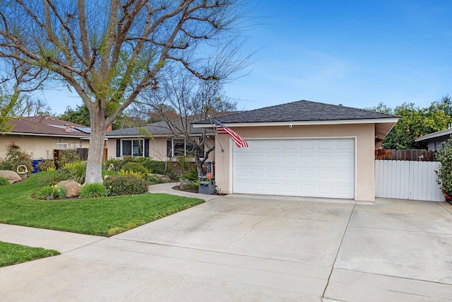 ranch-style house featuring driveway, an attached garage, fence, and stucco siding