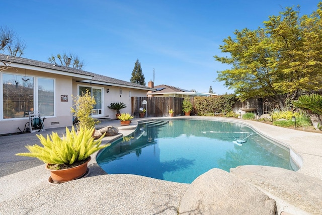 view of pool featuring a patio, fence, and a fenced in pool