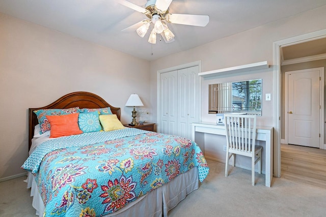 bedroom with carpet floors, a closet, ceiling fan, and baseboards