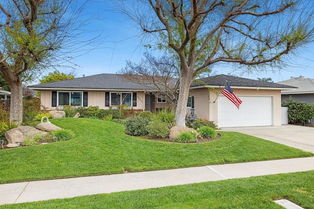 ranch-style home featuring concrete driveway, a front lawn, an attached garage, and stucco siding