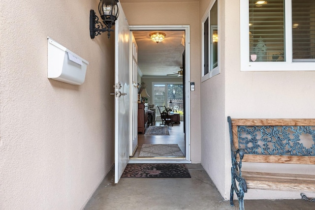 view of exterior entry featuring stucco siding