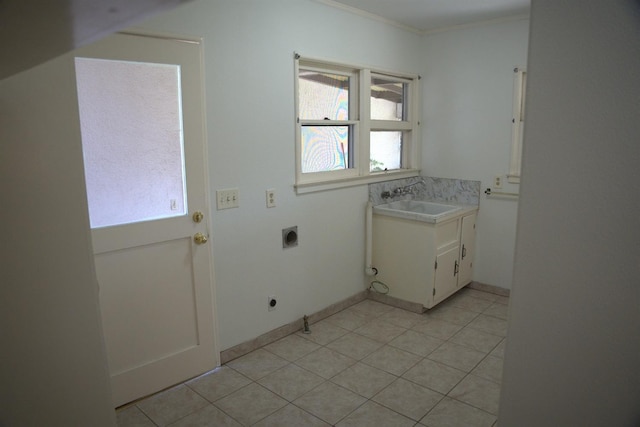 clothes washing area featuring ornamental molding, a sink, electric dryer hookup, and light tile patterned floors