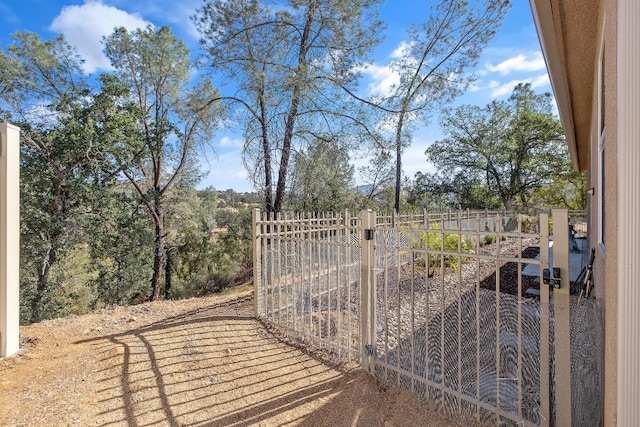 view of gate featuring fence