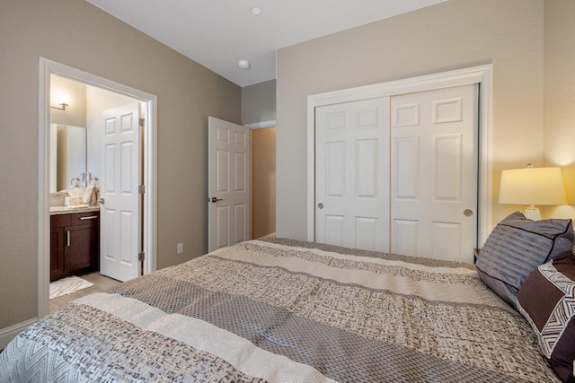 bedroom featuring a closet and ensuite bathroom