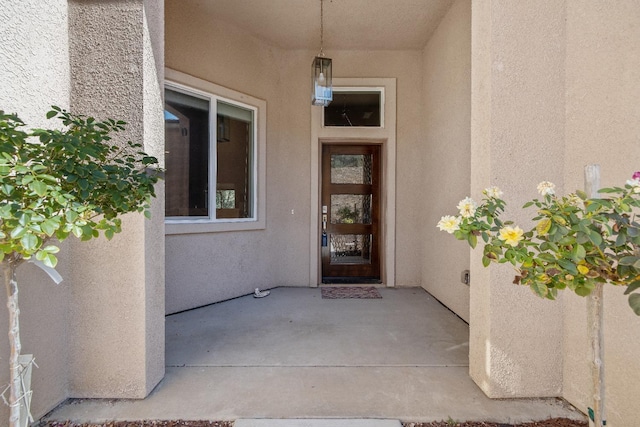 doorway to property with stucco siding