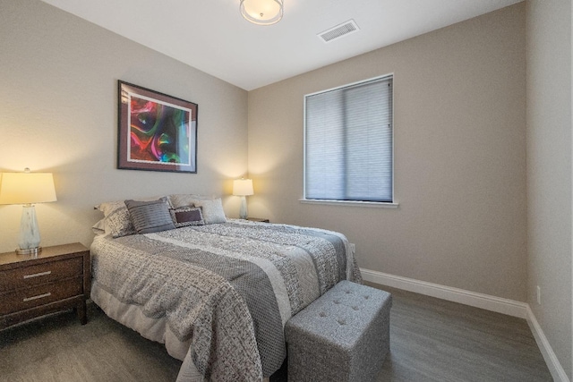 bedroom with carpet, visible vents, and baseboards