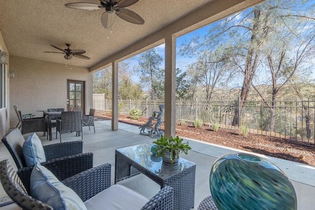 view of patio / terrace featuring a ceiling fan, outdoor dining area, a fenced backyard, and an outdoor hangout area