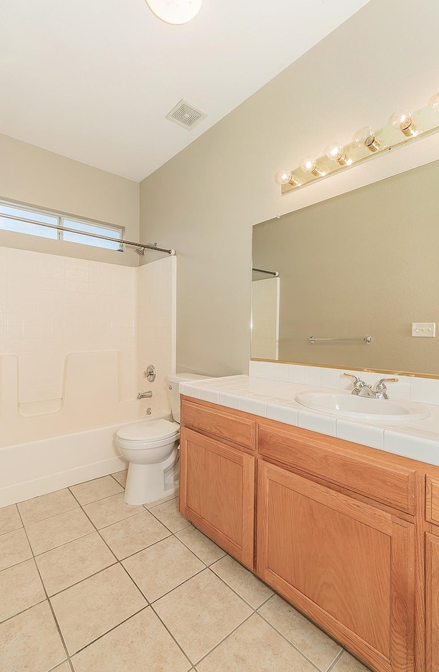 bathroom with visible vents, toilet, tile patterned floors, vanity, and washtub / shower combination