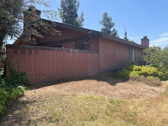 view of home's exterior with a chimney