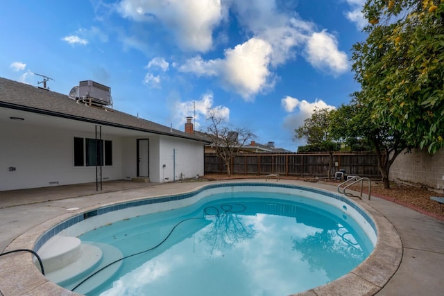 view of pool with a fenced in pool, a fenced backyard, and a patio