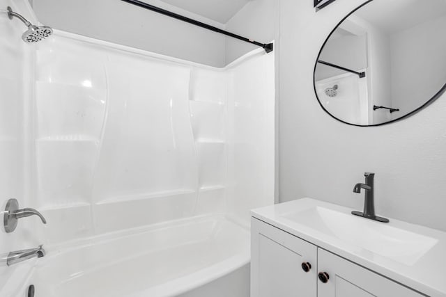 bathroom featuring vanity and bathing tub / shower combination