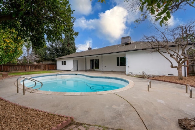 view of swimming pool featuring a fenced in pool, a patio area, fence, and central AC