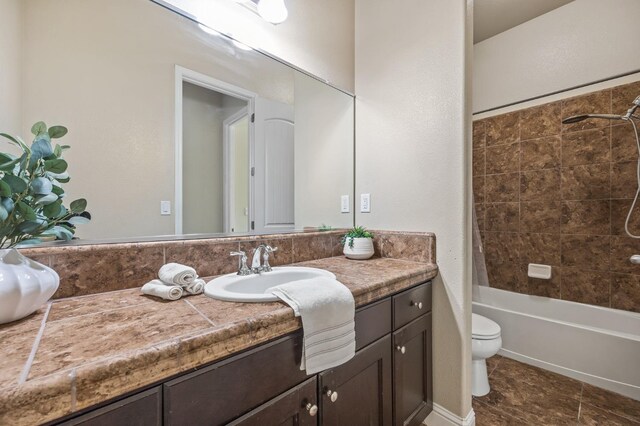 full bath featuring toilet, shower / bath combination with curtain, vanity, and tile patterned floors