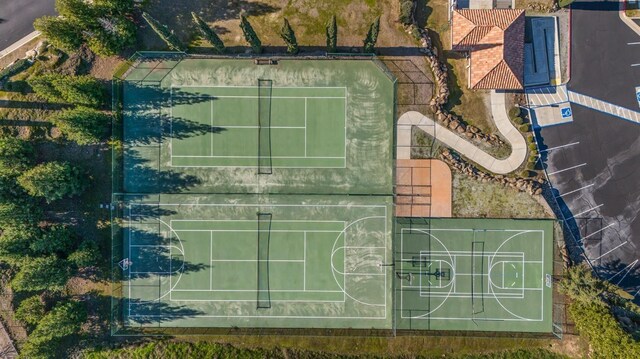 view of basketball court featuring community basketball court and fence