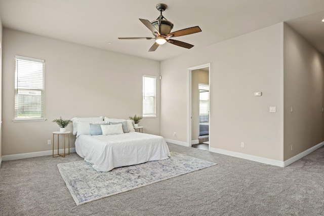 carpeted bedroom featuring ceiling fan and baseboards