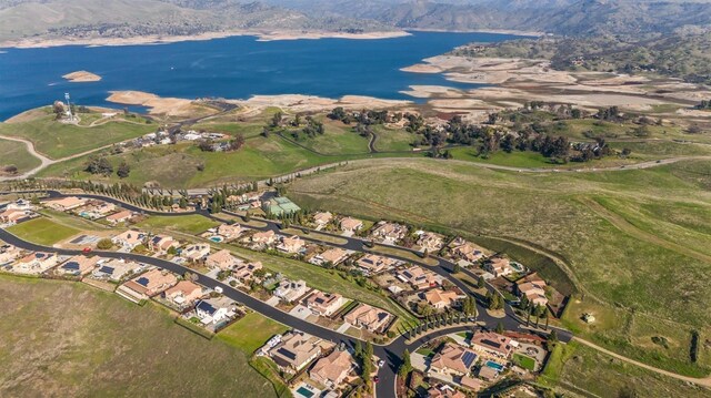 bird's eye view featuring a water view and a residential view