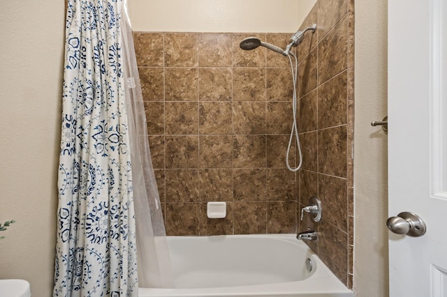 bathroom with shower / bath combination with curtain