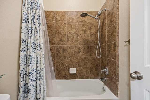 full bathroom featuring shower / bath combination with curtain
