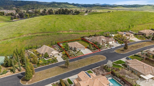 bird's eye view featuring a mountain view and a residential view