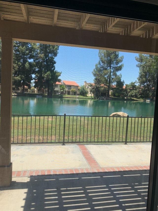 view of patio with a water view