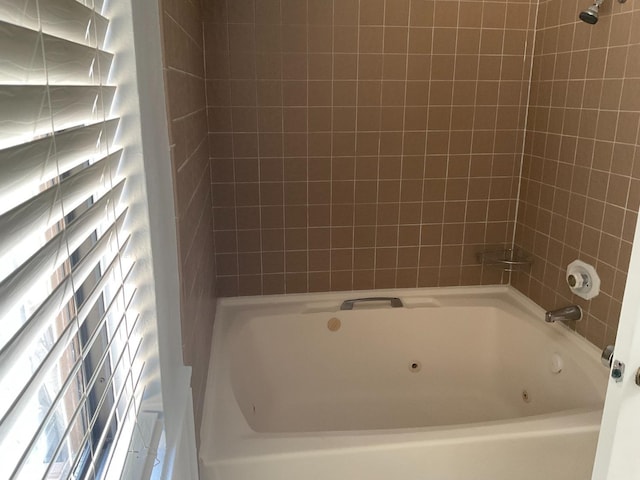 bathroom featuring a combined bath / shower with jetted tub