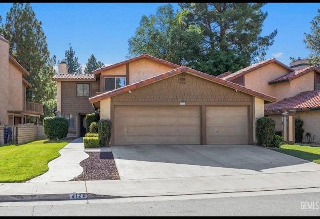 view of front of house with an attached garage, fence, a tile roof, concrete driveway, and a chimney