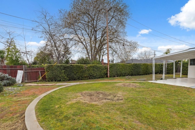 view of yard featuring fence and a patio area