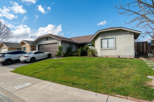 ranch-style home featuring driveway, a garage, stucco siding, fence, and a front yard