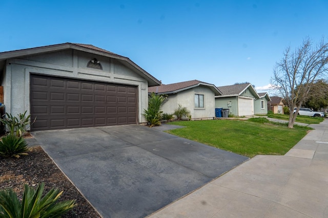 ranch-style house with concrete driveway, a front lawn, an attached garage, and stucco siding