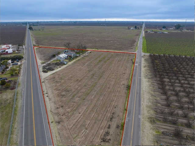 birds eye view of property with a rural view