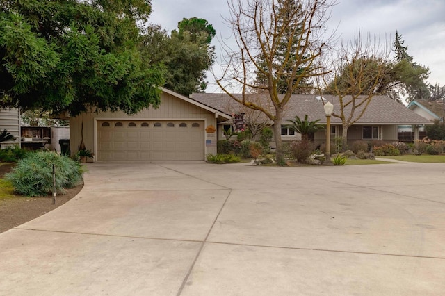 view of front of house with a garage and concrete driveway